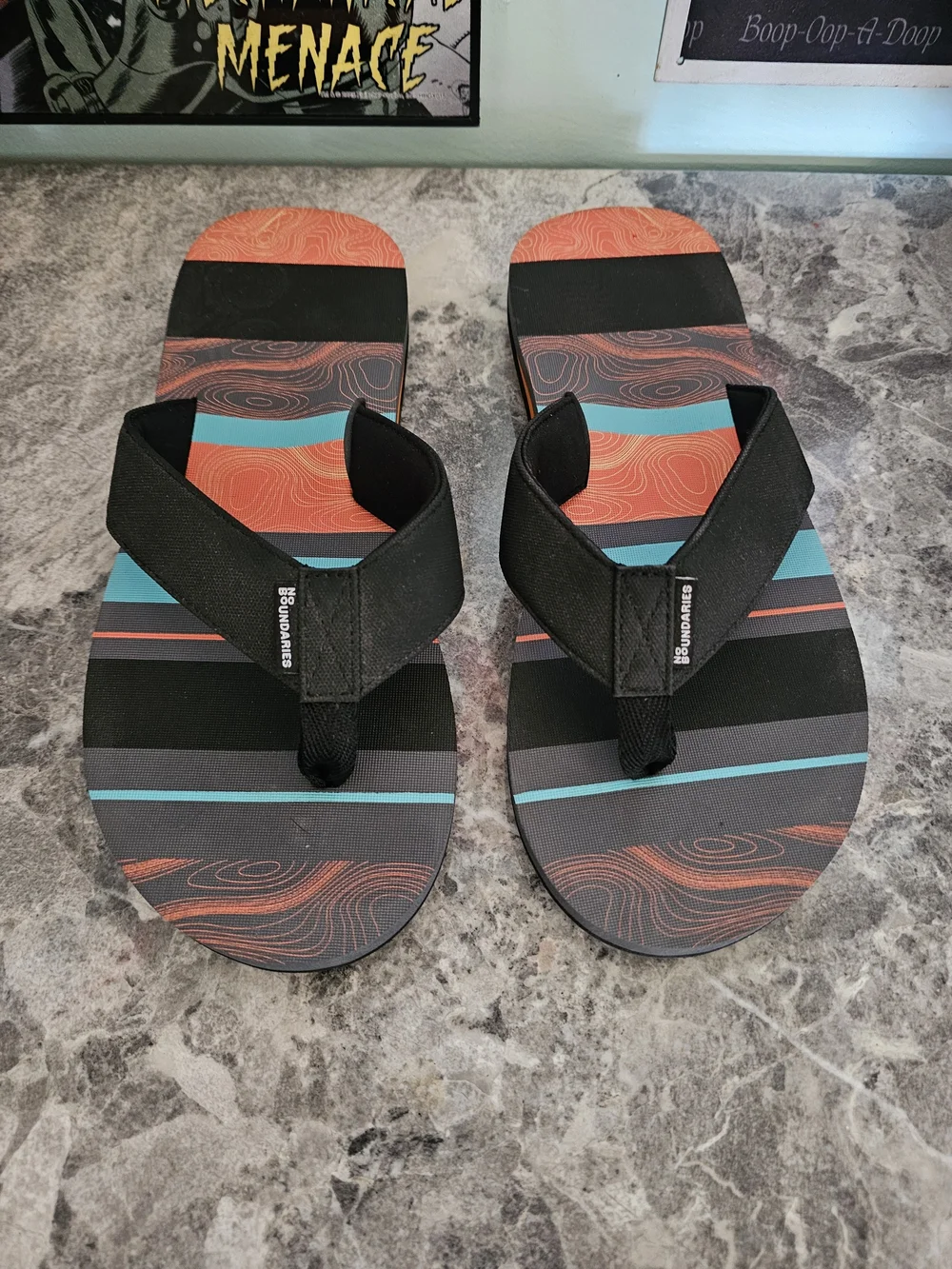 No Boundaries Men’s Black Flip-Flops with Orange and Teal Stripes